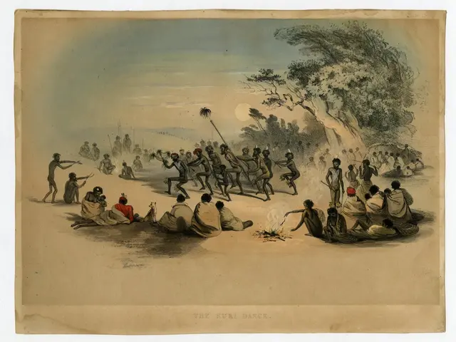 The image shows a group of people sitting around a fire in the middle of a field, surrounded by...