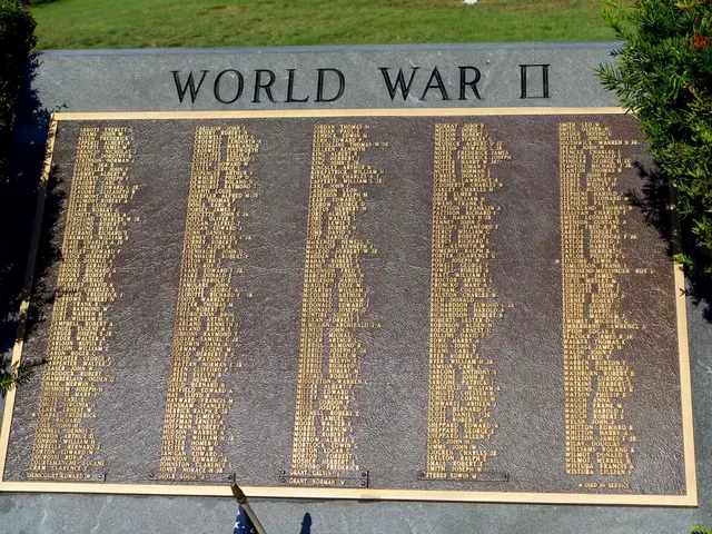 The image shows a memorial stone with the words "World War II" inscribed on it, surrounded by...