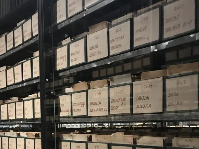 The image shows a large warehouse filled with lots of boxes stacked on top of each other. The boxes...