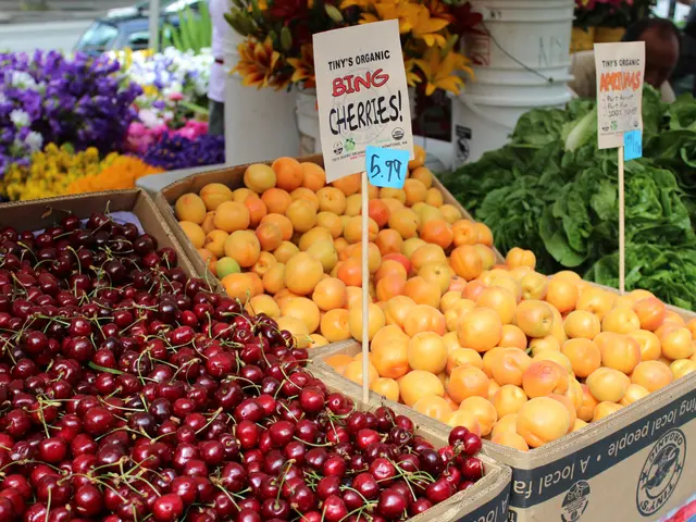 The image shows a farmers market with a variety of fruits and vegetables on display. There are...