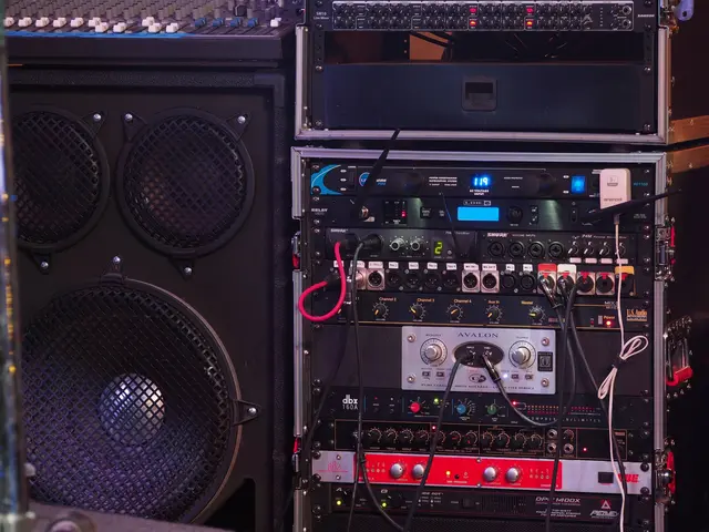 The image shows a room filled with lots of different types of audio equipment, including speakers,...